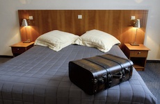 suitcase resting on a bed