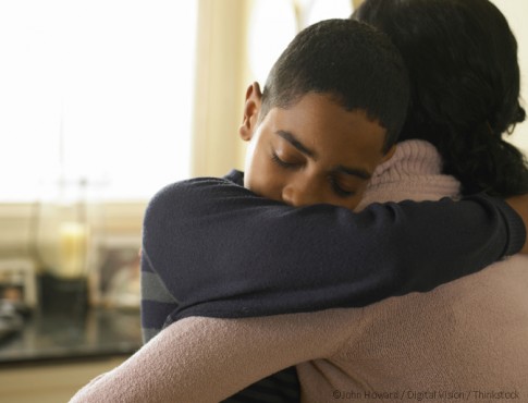 Boy Hugging His Mother