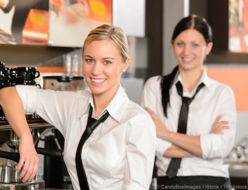 Two waitresses posing in coffee house
