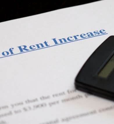 rent increase notice on desk with calculator