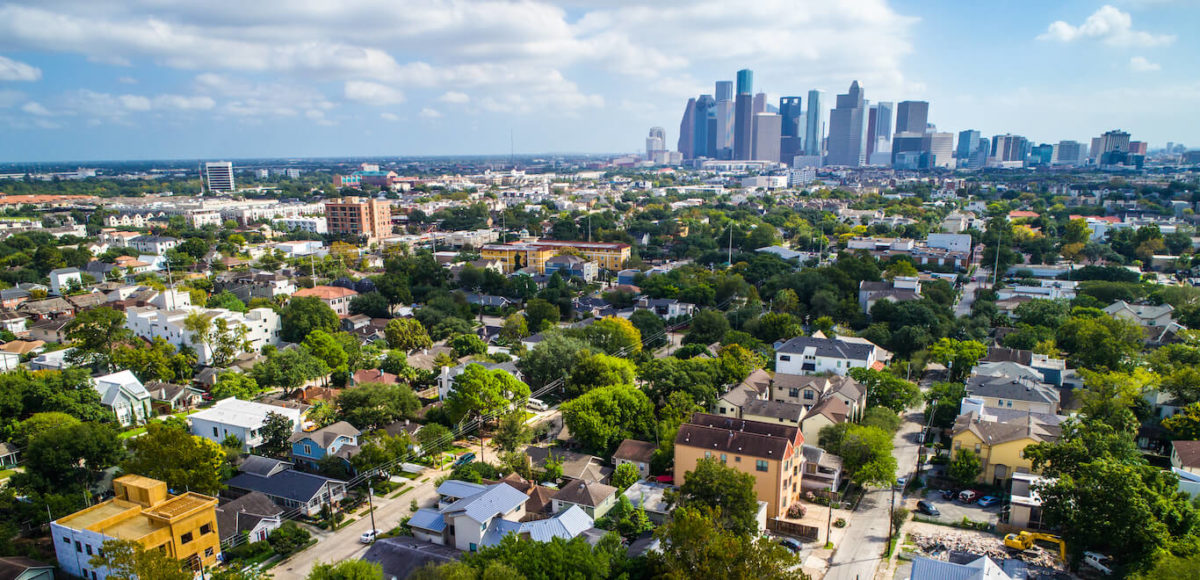 A daytime skyline shot of the surrounding suburbs and city of Houston, Texas.