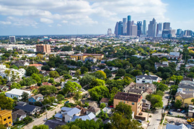 A daytime skyline shot of the surrounding suburbs and city of Houston, Texas.