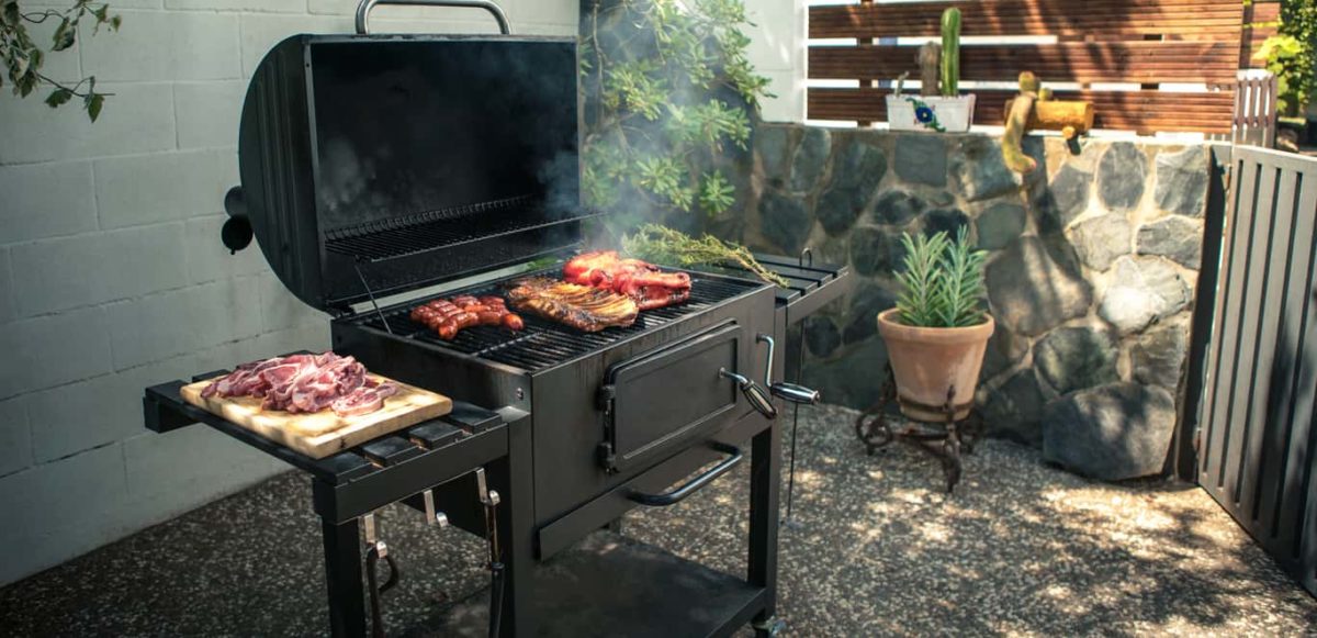 BBQ pit on small patio.