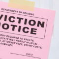 Pink eviction notice slip taped to door can a landlord kick you out