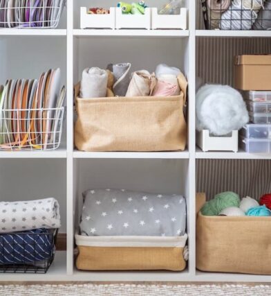 Small, square shelves store yarn and other art supplies.